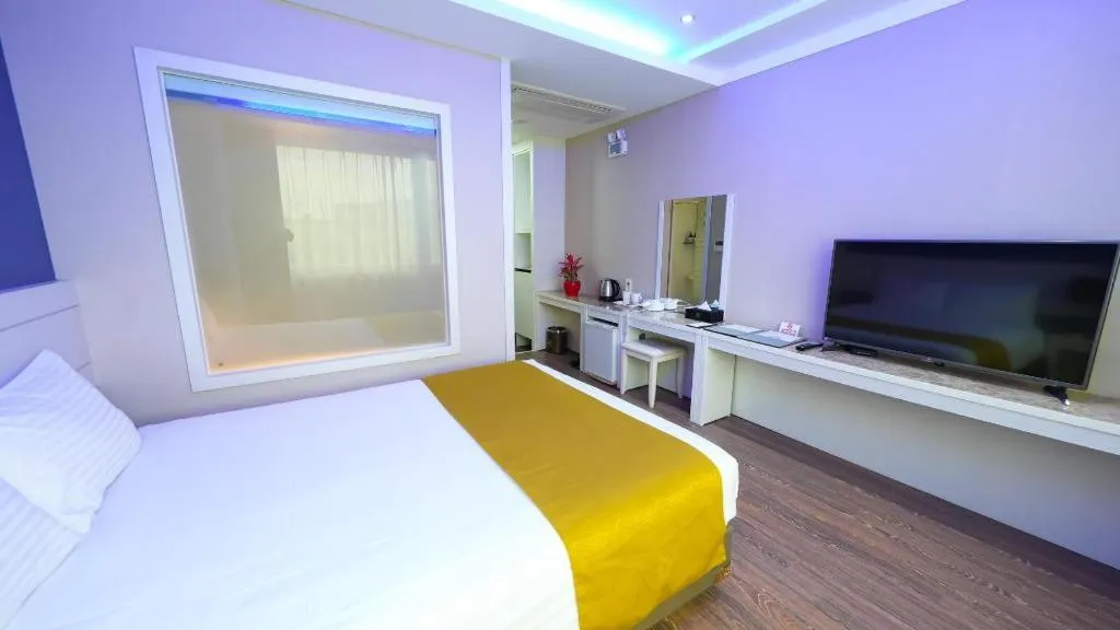 Bed in Galaxy Hotel