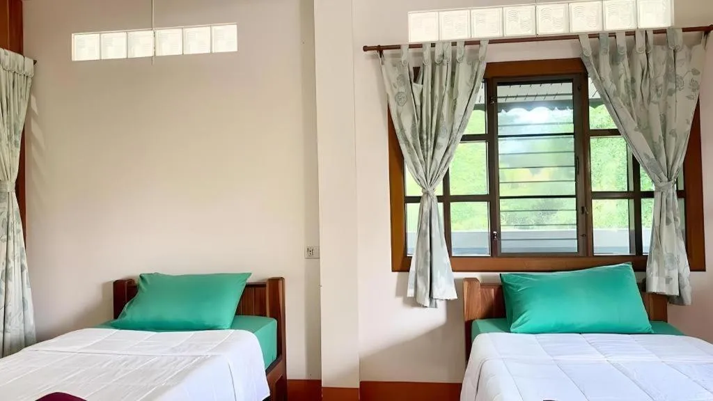 Bed in Phuphan Park Hotel