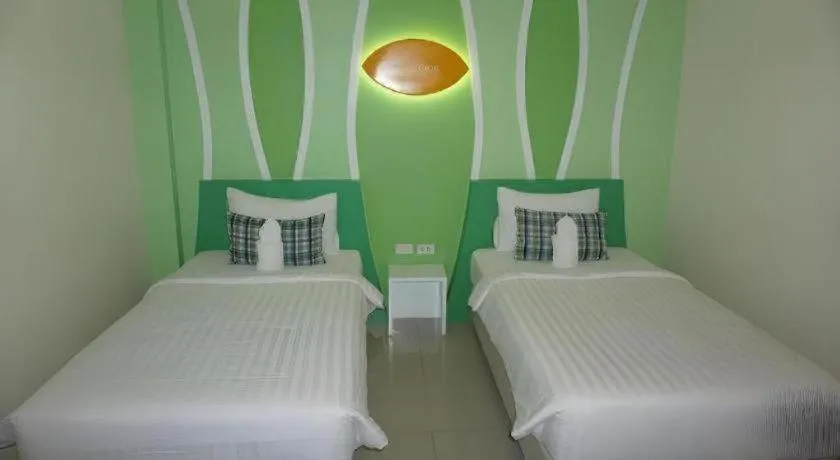 Bed in The Rice Hotel