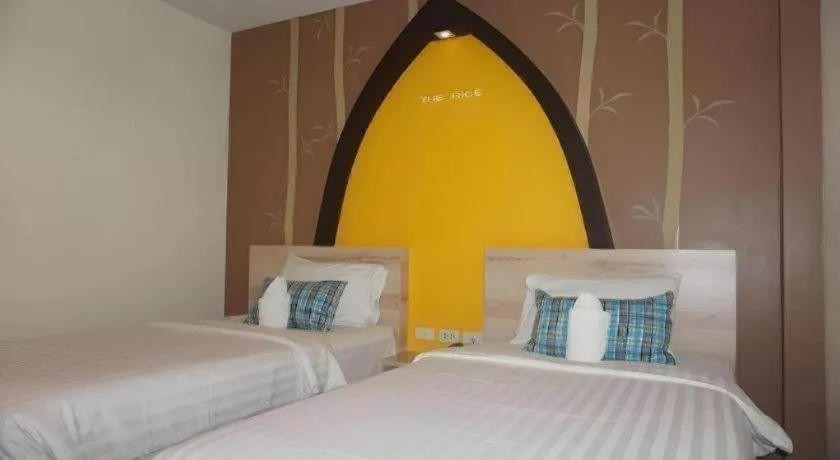 Bed in The Rice Hotel