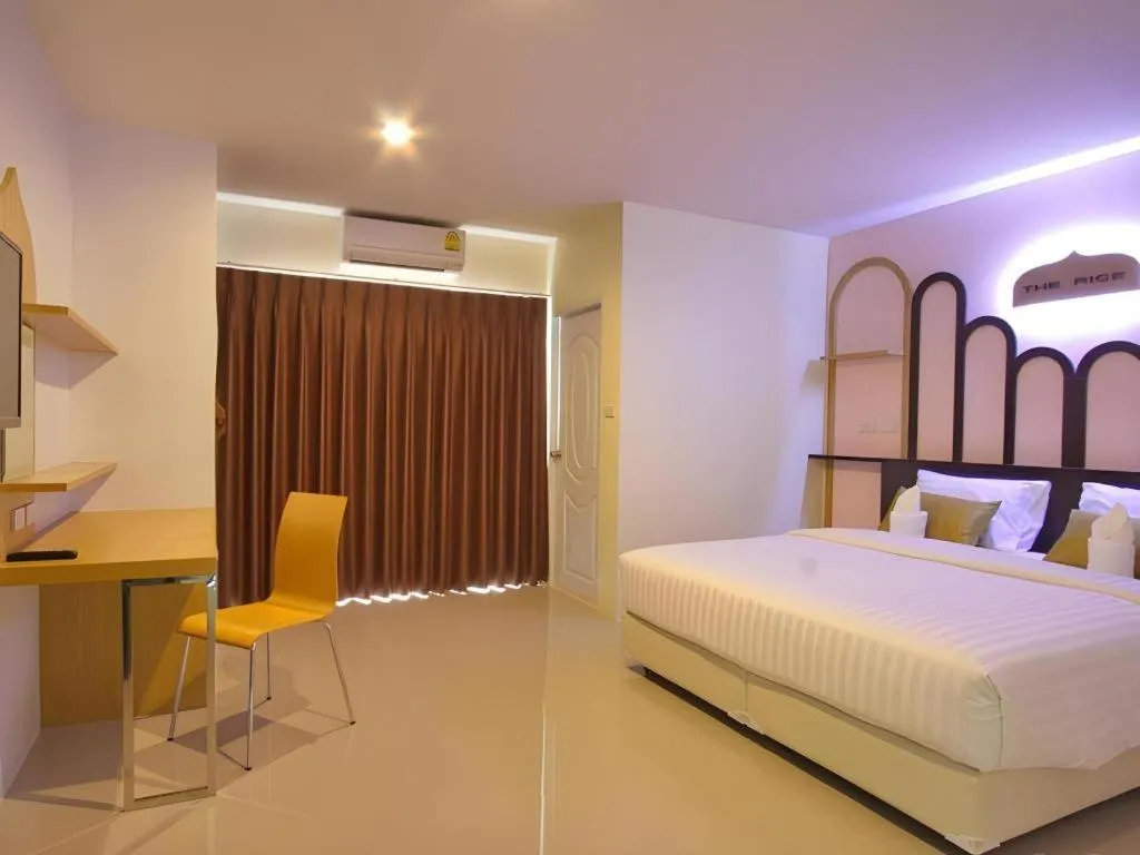 Bed in The Rice Hotel