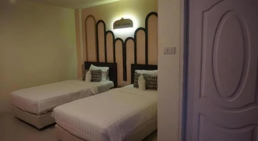 Bed in The Rice Hotel