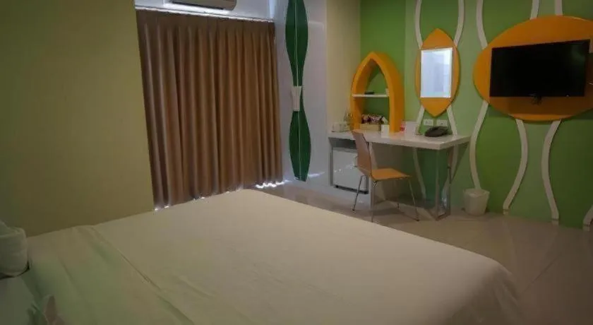 Bed in The Rice Hotel