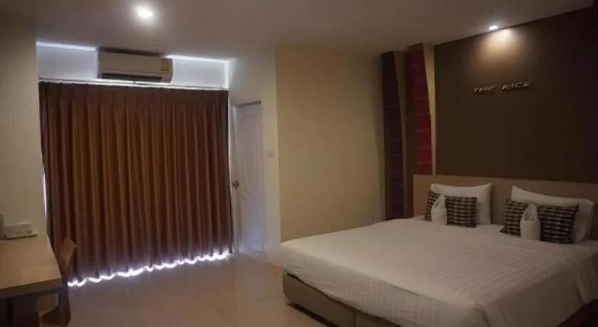 Bed in The Rice Hotel