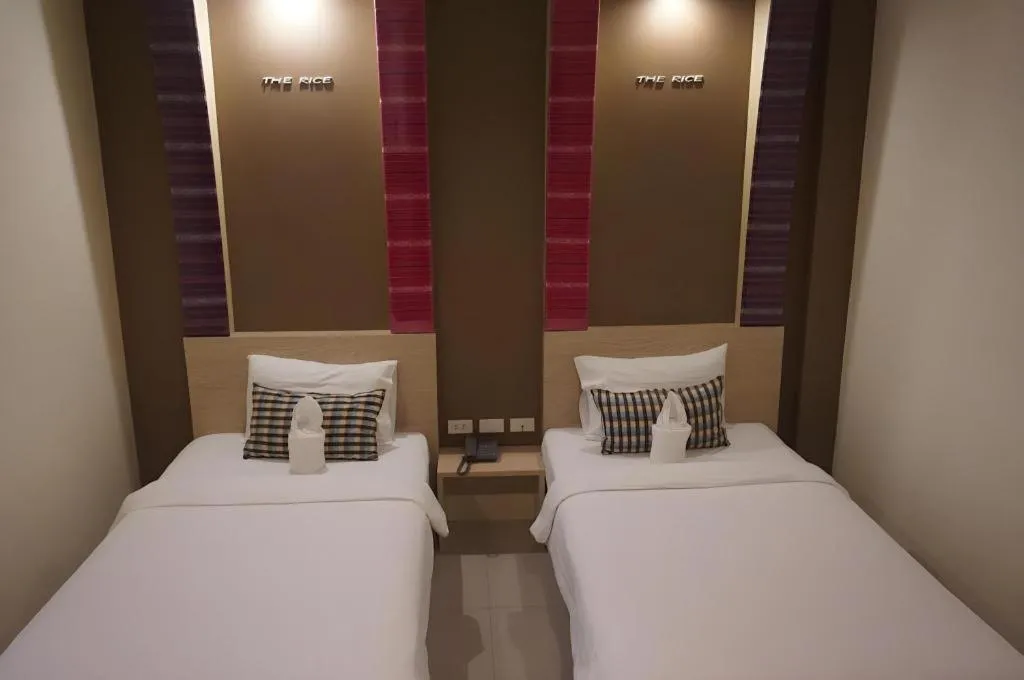 Bed in The Rice Hotel