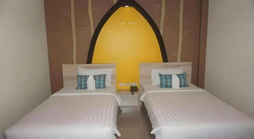 Bed in The Rice Hotel