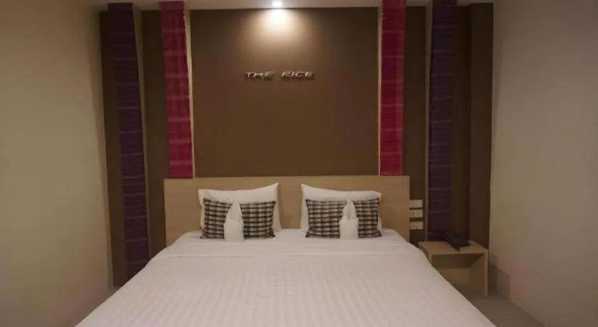 Bed in The Rice Hotel