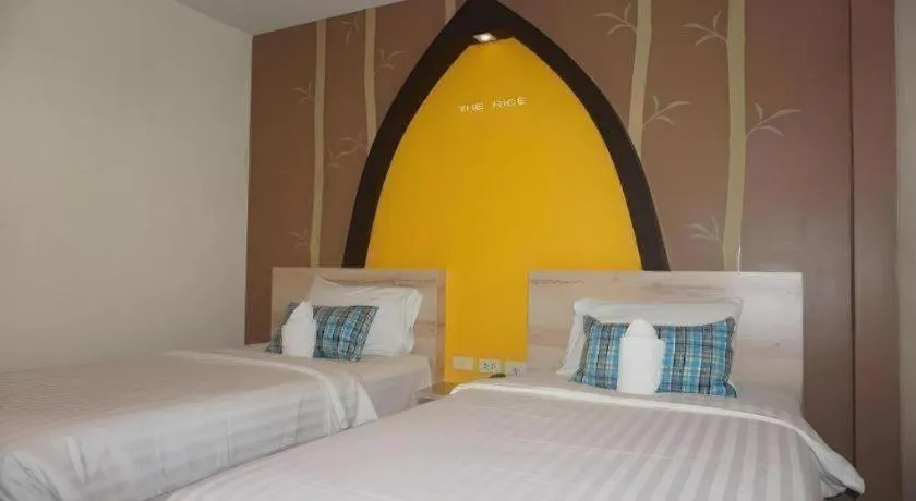 Bed in The Rice Hotel