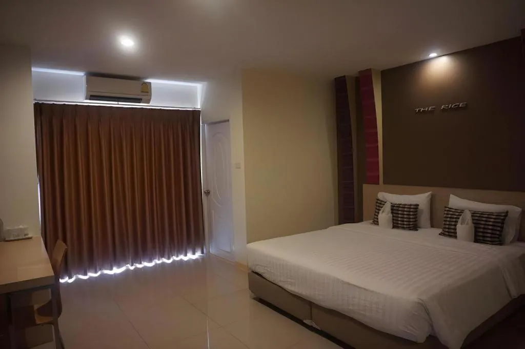 Bed in The Rice Hotel