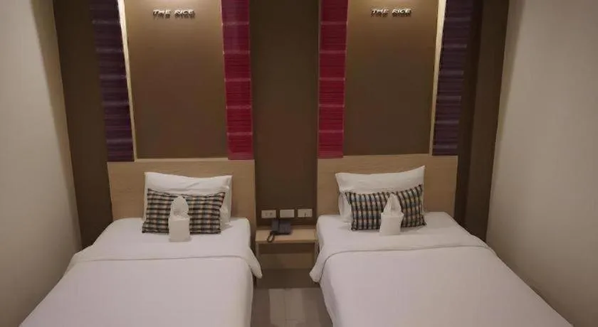 Bed in The Rice Hotel