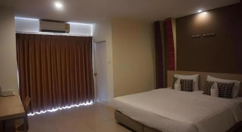 Bed in The Rice Hotel