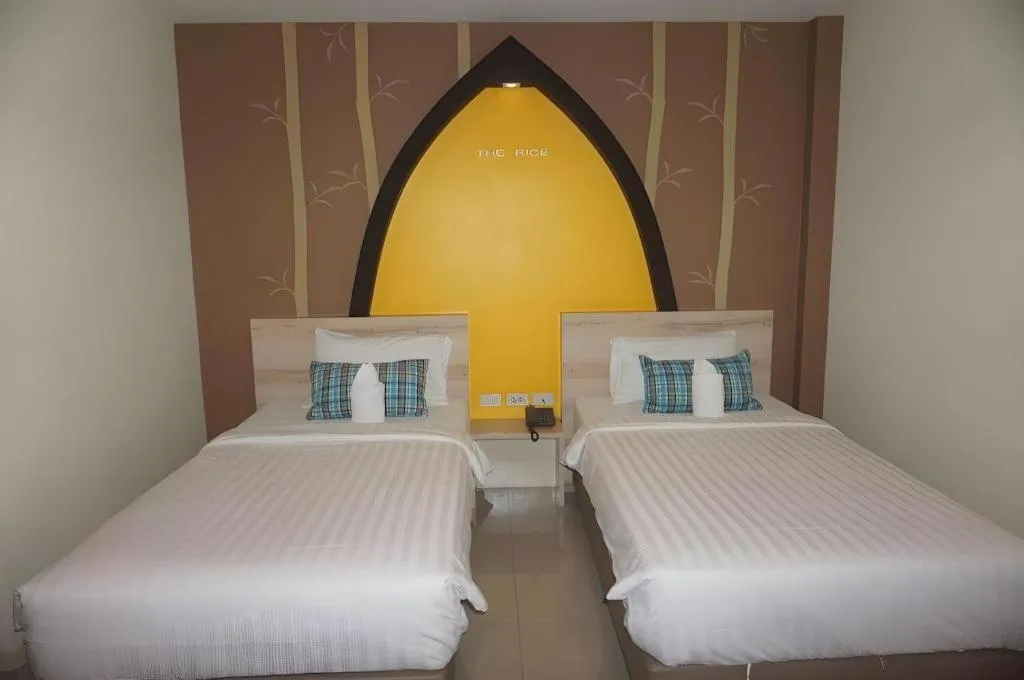 Bed in The Rice Hotel