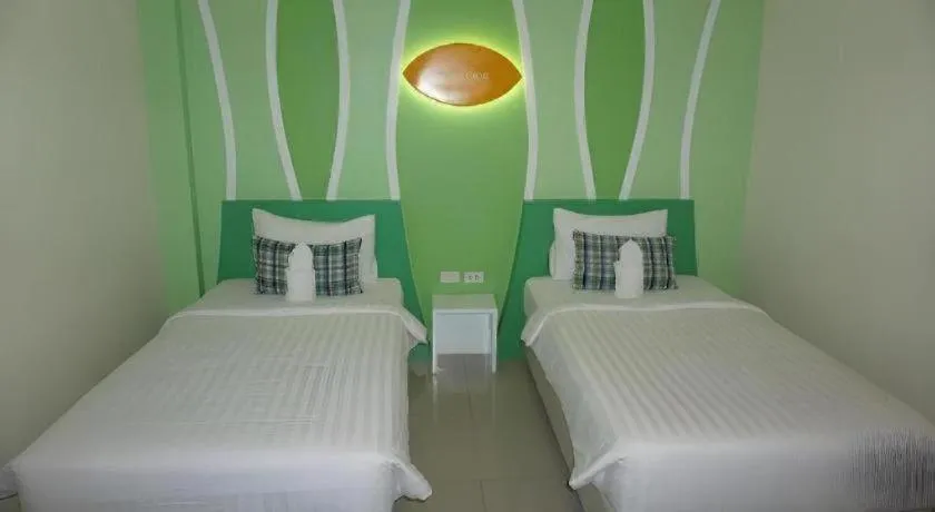 Bed in The Rice Hotel