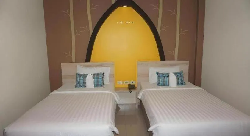 Bed in The Rice Hotel