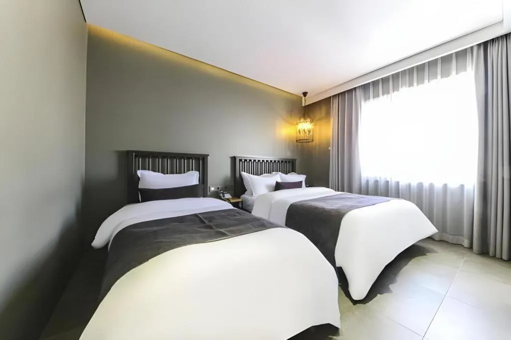 Bed in Daejeon Namoo Hotel