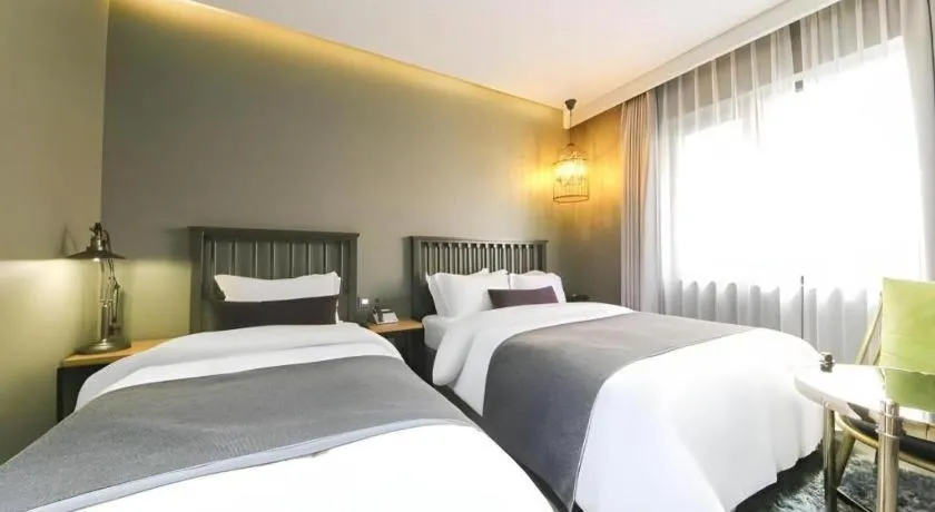 Bed in Daejeon Namoo Hotel