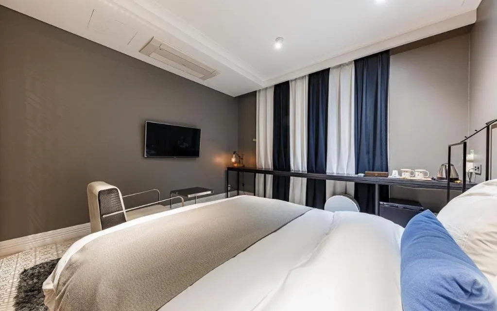 Bed in Daejeon Namoo Hotel