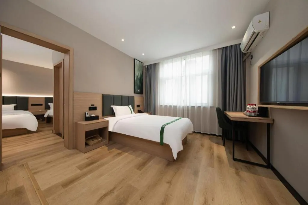 Bed in GreenTree Inn Zhejiang Ningbo Exhibition and Convention Center Bus East Station Express Hotel
