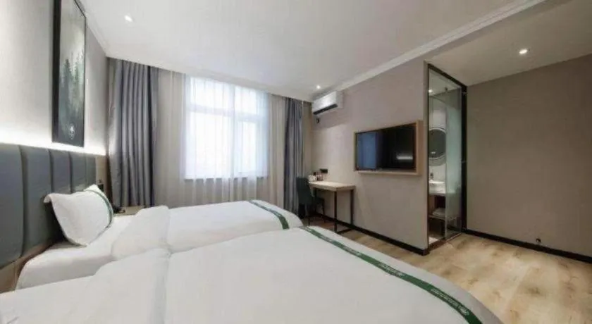 Bed in GreenTree Inn Zhejiang Ningbo Exhibition and Convention Center Bus East Station Express Hotel