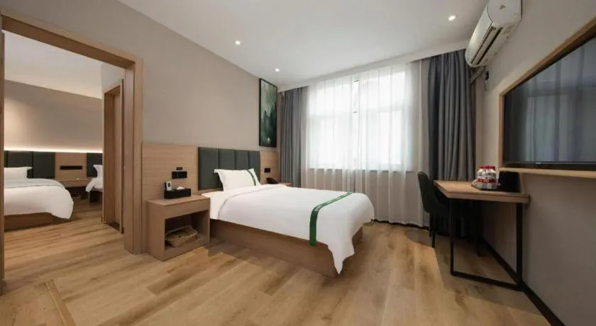 Bed in GreenTree Inn Zhejiang Ningbo Exhibition and Convention Center Bus East Station Express Hotel