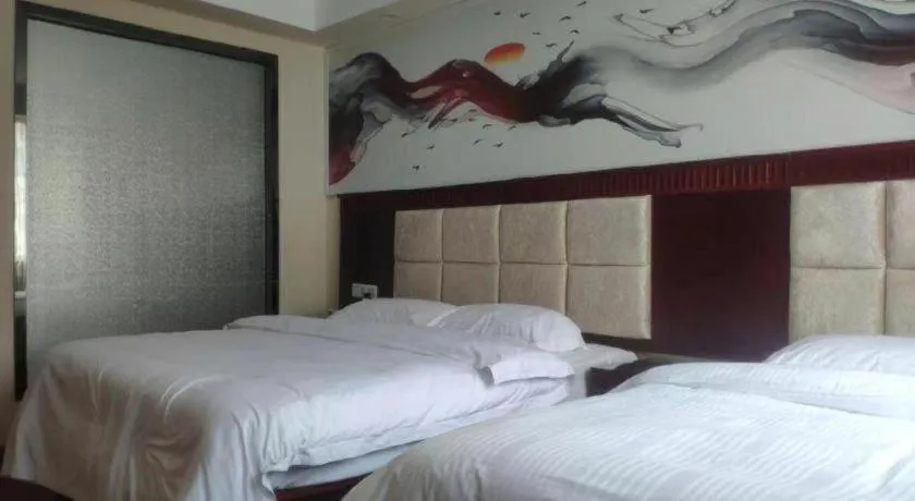 Bed in GreenTree Inn Guangzhou Baiyun International Airport Huaxi Road Express Hotel