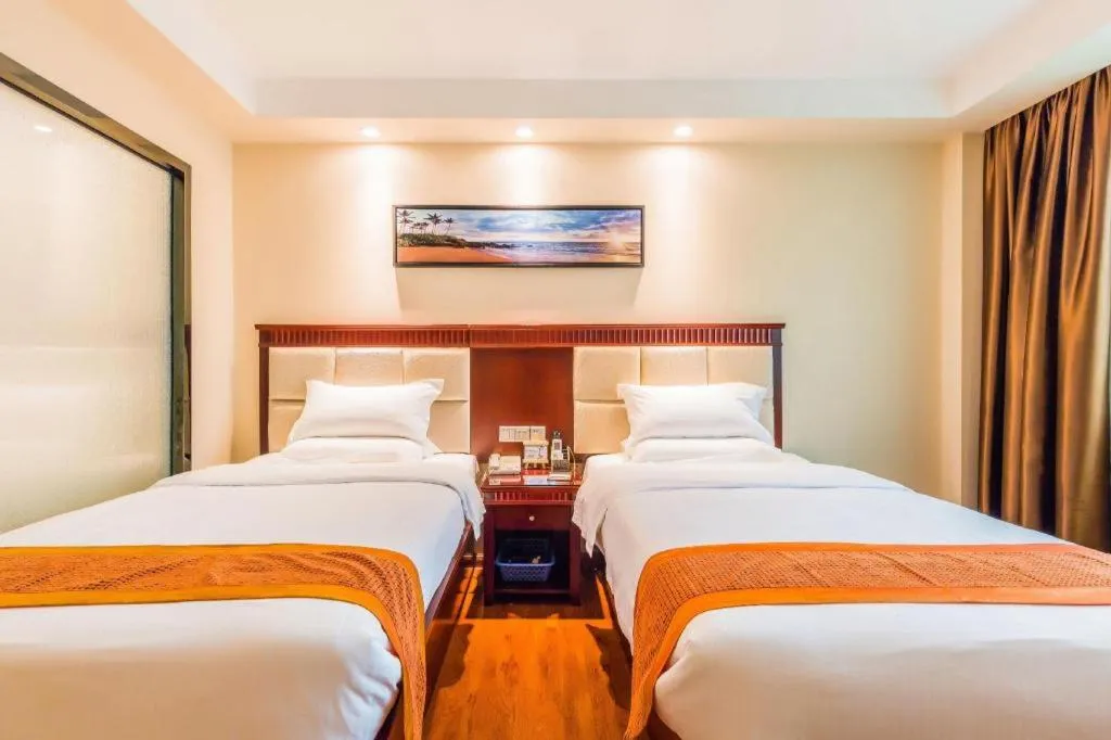 Bed in GreenTree Inn Guangzhou Baiyun International Airport Huaxi Road Express Hotel