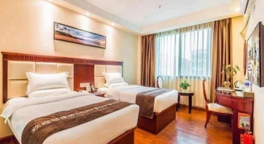 Bed in GreenTree Inn Guangzhou Baiyun International Airport Huaxi Road Express Hotel