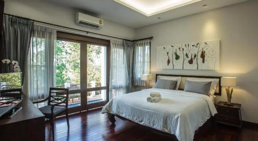 Bed in Doltara Boutique Resort