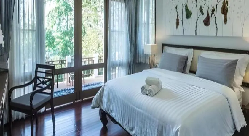 Bed in Doltara Boutique Resort
