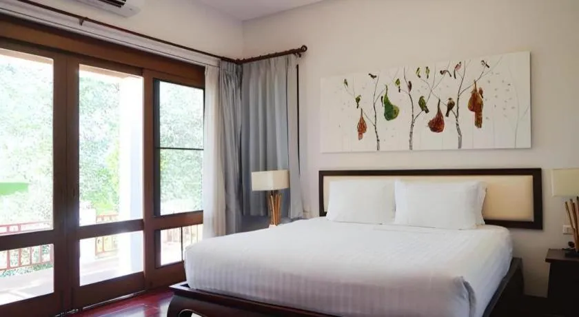 Bed in Doltara Boutique Resort