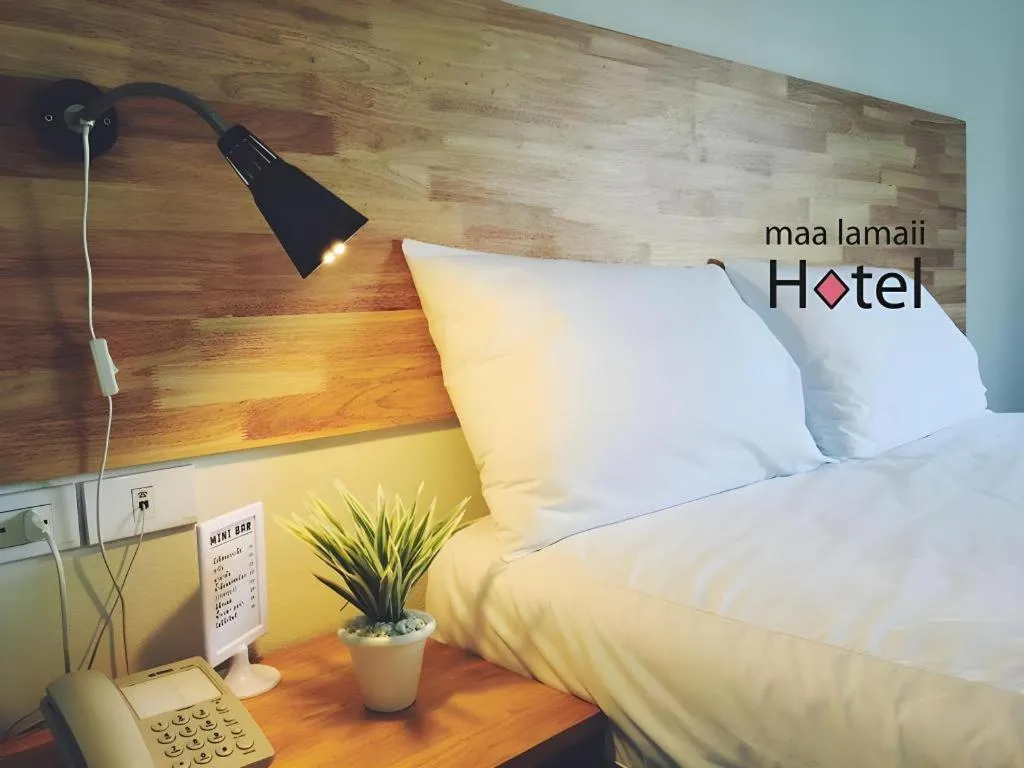 Bed in Maalamaii Hotel