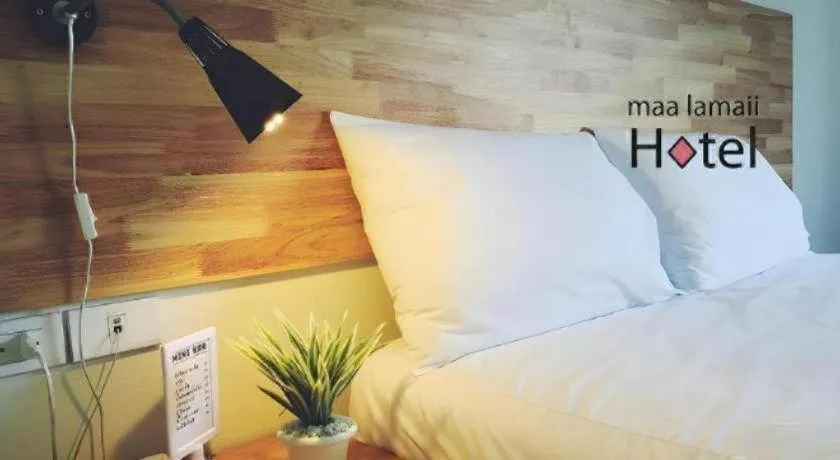 Bed in Maalamaii Hotel