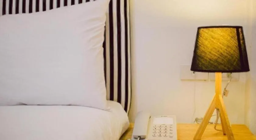 Bed in Maalamaii Hotel