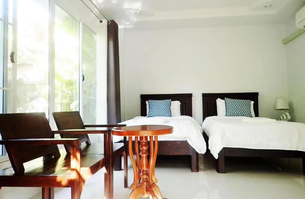 Bed in Rommai Rimnaam Resort