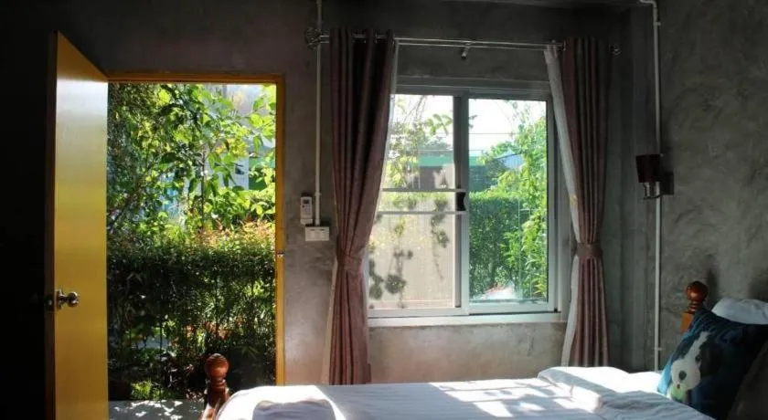 Bed in Rommai Rimnaam Resort