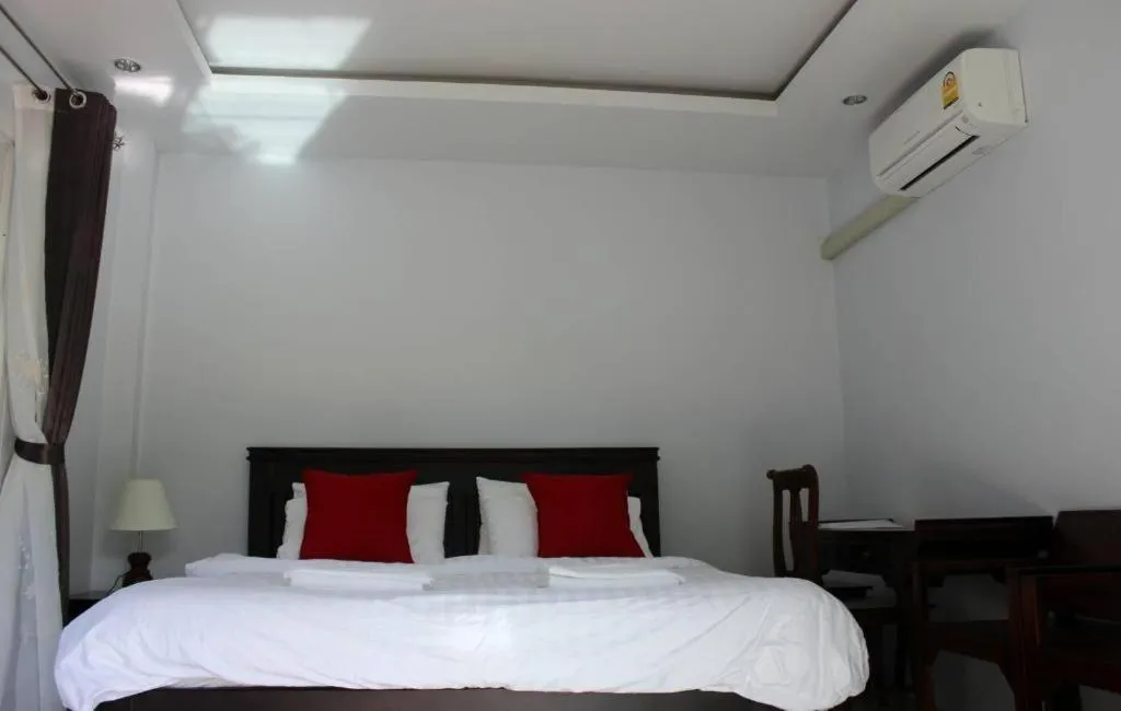 Bed in Rommai Rimnaam Resort