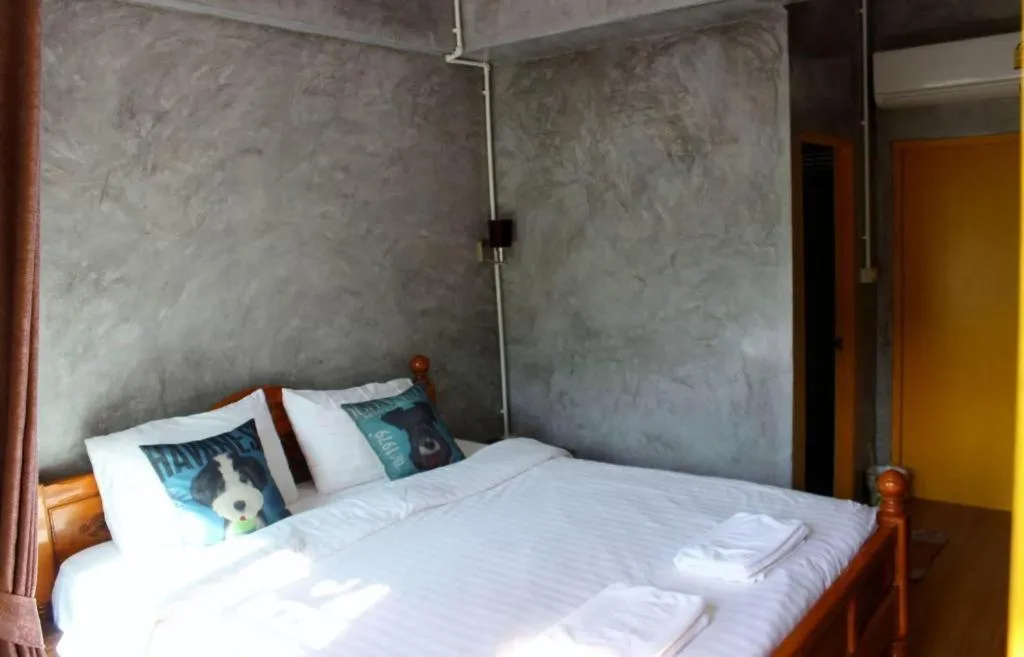 Bed in Rommai Rimnaam Resort