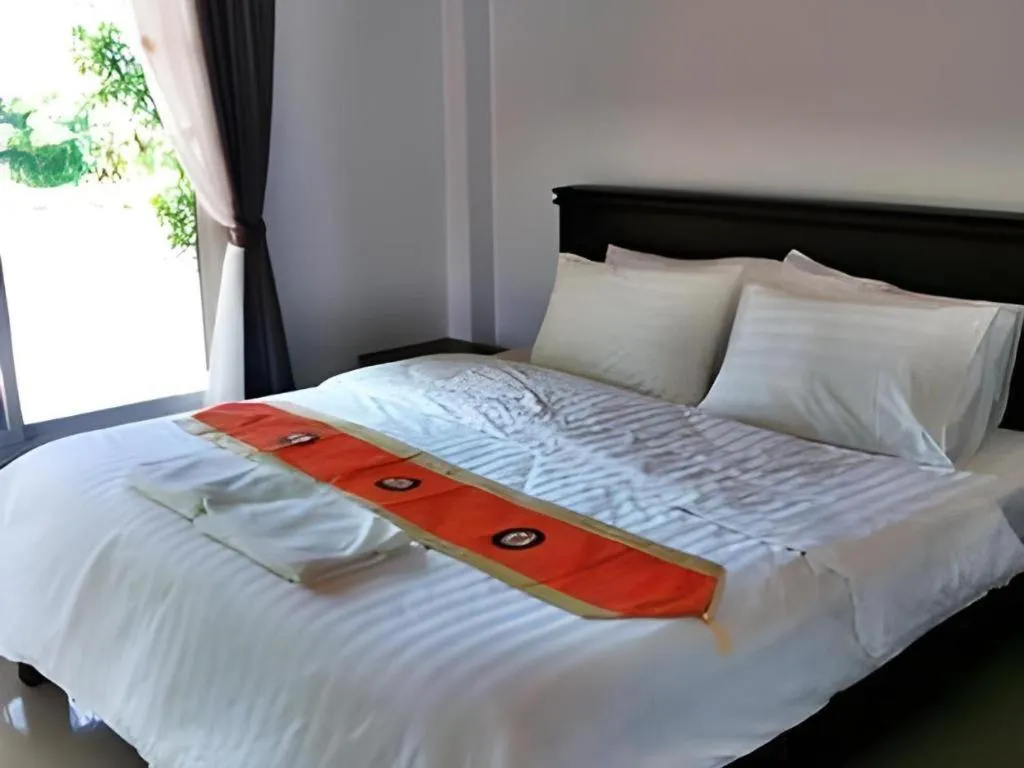 Bed in Rommai Rimnaam Resort