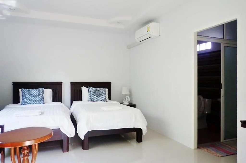 Bed in Rommai Rimnaam Resort