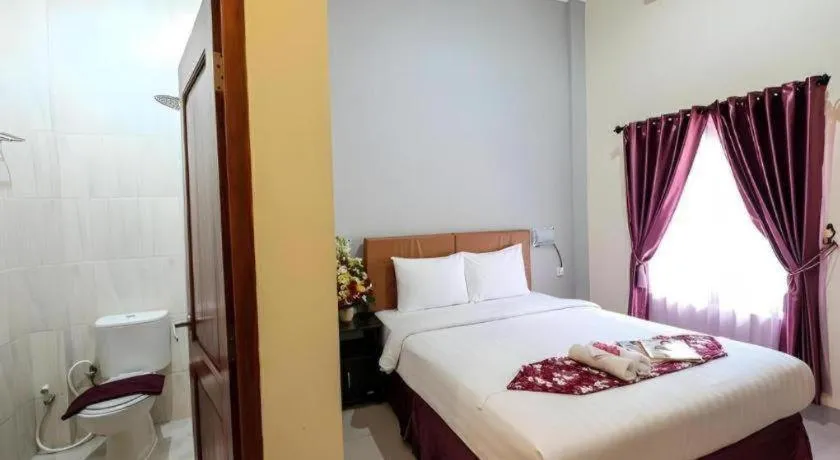 Bed in Malioboro Garden Hotel Yogyakarta