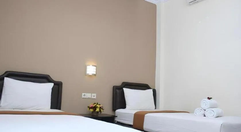 Bed in Malioboro Garden Hotel Yogyakarta