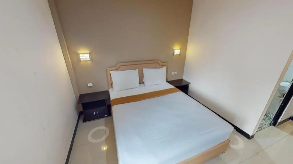 Bed in Malioboro Garden Hotel Yogyakarta