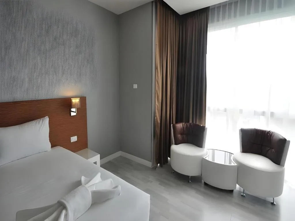 Bed in Tanzeno Hotel