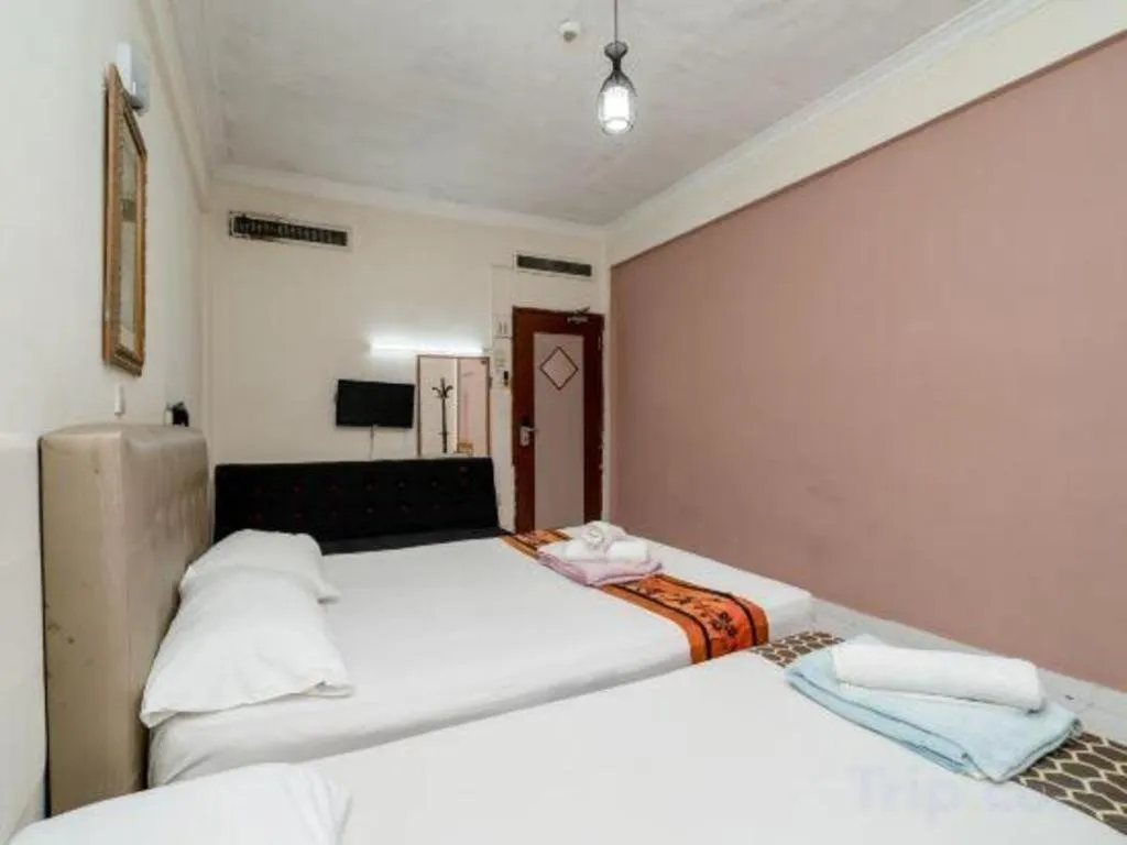 Bed in Lai Ming Hotel Cosmoland