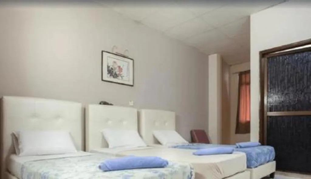 Bed in Lai Ming Hotel Cosmoland