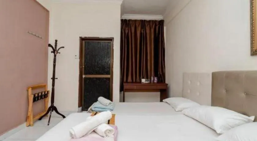 Bed in Lai Ming Hotel Cosmoland