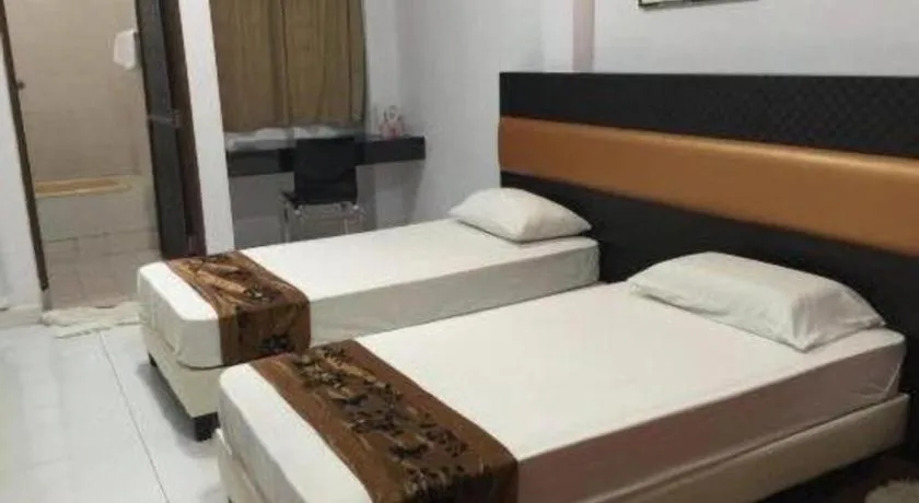 Bed in Lai Ming Hotel Cosmoland