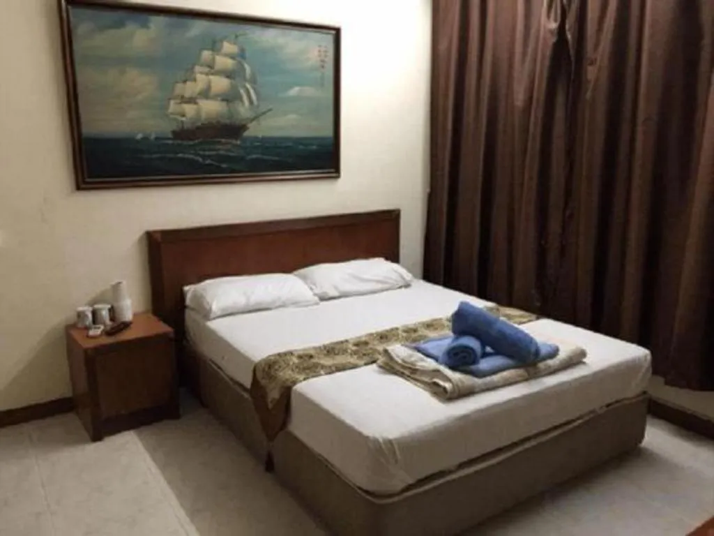 Bed in Lai Ming Hotel Cosmoland