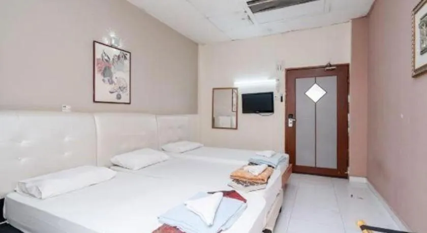 Bed in Lai Ming Hotel Cosmoland