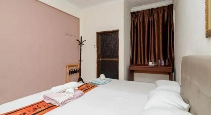 Bed in Lai Ming Hotel Cosmoland